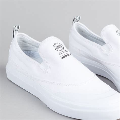 white Adidas slip ons